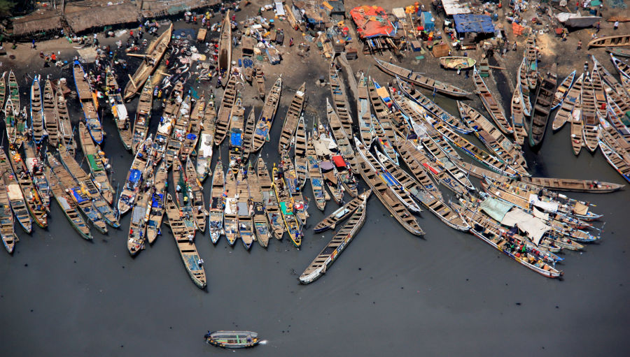 An aerial photograph of fishing boats in Accra Point, Ghana