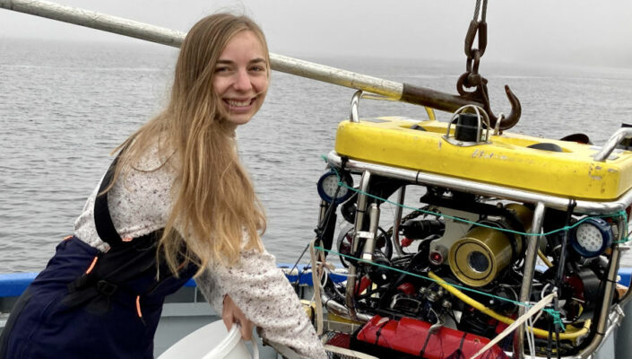 One Ocean Hub researcher Kelsey Archer Barnhill on a boat.